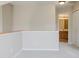 Upstairs hallway with gray carpet, neutral walls, and a view of the bathroom and closet at 9406 Avon Strand # Apt A, Avon, IN 46123