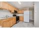 Well-lit kitchen with stainless steel appliances and light wood cabinetry at 9406 Avon Strand # Apt A, Avon, IN 46123