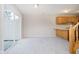 Cozy kitchenette area with sliding glass doors, and stairs at 9406 Avon Strand # Apt A, Avon, IN 46123