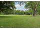 Expansive backyard featuring a massive yard and mature trees, perfect for outdoor activities at 9974 N 850 W, Fairland, IN 46126