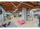 View of the unfinished basement space with exposed wood rafters and utility area at 9974 N 850 W, Fairland, IN 46126
