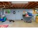 View of the unfinished basement space, featuring light blue block walls and concrete flooring at 9974 N 850 W, Fairland, IN 46126