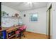 Bright bedroom with hardwood floors, a single window, and desk area with a chair at 9974 N 850 W, Fairland, IN 46126