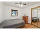 Simple bedroom with hardwood floors, a single window, and a mirrored closet door at 9974 N 850 W, Fairland, IN 46126