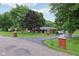Beautiful brick home with a curving driveway framed by brick pillars and mature trees at 9974 N 850 W, Fairland, IN 46126