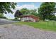 Charming brick ranch home with a white railed porch and a well-maintained front yard at 9974 N 850 W, Fairland, IN 46126