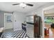Practical kitchen with checkerboard flooring and stainless steel refrigerator at 9974 N 850 W, Fairland, IN 46126