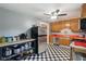 Traditional kitchen featuring black and white checkered floor, stainless steel appliances, and orange countertops at 9974 N 850 W, Fairland, IN 46126