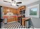 Traditional kitchen featuring black and white checkered floor, stainless steel appliances, and orange countertops at 9974 N 850 W, Fairland, IN 46126
