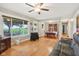 Bright living space featuring hardwood floors, fireplace, and large windows with backyard views at 9974 N 850 W, Fairland, IN 46126