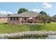 Charming brick home with patio, lawn, and pond with beautiful rock border at 1027 Plum St # 39, Brownsburg, IN 46112
