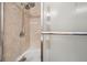 Close up of the shower in bathroom, featuring a detachable shower head and frosted glass door at 1027 Plum St # 39, Brownsburg, IN 46112