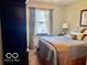 Comfortable bedroom with soft bedding, natural light, and ample space at 1027 Plum St # 39, Brownsburg, IN 46112