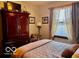 Cozy bedroom with comfortable bed, wooden furniture, and natural light at 1027 Plum St # 39, Brownsburg, IN 46112