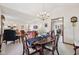 The open plan living area flows into the spacious dining area with a chandelier at 1027 Plum St # 39, Brownsburg, IN 46112