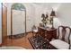 Inviting foyer featuring hardwood floors, a decorative rug, and a stylish accent table at 1027 Plum St # 39, Brownsburg, IN 46112