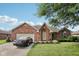 Charming brick home with manicured lawn, two-car garage, and well-maintained landscaping at 1027 Plum St # 39, Brownsburg, IN 46112