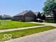 Well-kept brick home with attached garage, green lawn, and inviting curb appeal at 1027 Plum St # 39, Brownsburg, IN 46112