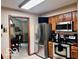 Well-equipped kitchen with stainless steel appliances, oak cabinets, and an open layout at 1027 Plum St # 39, Brownsburg, IN 46112