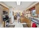 Modern kitchen with wood cabinets, connecting to cozy living space at 1027 Plum St # 39, Brownsburg, IN 46112