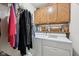 Convenient laundry room features cabinetry above the appliances for storing detergent and related cleaning supplies at 1027 Plum St # 39, Brownsburg, IN 46112