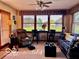 Bright and airy living room with large windows, comfortable seating, and natural light at 1027 Plum St # 39, Brownsburg, IN 46112