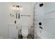 Clean white bathroom with a modern vanity, toilet, and tiled shower and bath combo at 1038 W 33Rd St, Indianapolis, IN 46208