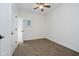 Cozy bedroom with neutral carpeting, ceiling fan, and white trim at 1038 W 33Rd St, Indianapolis, IN 46208