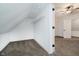 Bright closet features carpeted floor and a shelf for organization in an all-white space at 1038 W 33Rd St, Indianapolis, IN 46208