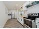 Bright kitchen features white cabinets, stainless steel appliances, and modern fixtures at 1038 W 33Rd St, Indianapolis, IN 46208
