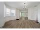 Open-concept living room showcases wood-look floors and abundant natural light at 1038 W 33Rd St, Indianapolis, IN 46208
