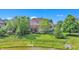 Spacious backyard overlooking a pond and lush trees at 10471 Winghaven Dr, Noblesville, IN 46060