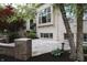 Backyard patio featuring brick retaining wall and stairs to yard and home at 10471 Winghaven Dr, Noblesville, IN 46060