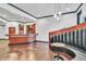 A finished basement bar area with booth, tile flooring, and pendant lighting at 10471 Winghaven Dr, Noblesville, IN 46060