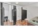 Clean restroom featuring private stalls, glass countertop and modern sinks at 10471 Winghaven Dr, Noblesville, IN 46060