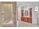 An elegant bathroom with a double sink vanity and a view of the bathtub at 10471 Winghaven Dr, Noblesville, IN 46060