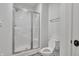 Bathroom with shower and glass door next to a toilet at 10471 Winghaven Dr, Noblesville, IN 46060