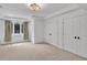 Bright bedroom with neutral carpet and large windows with decorative drapes at 10471 Winghaven Dr, Noblesville, IN 46060
