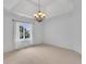 Spacious bedroom with neutral carpet, bright window with curtains, and a stylish light fixture at 10471 Winghaven Dr, Noblesville, IN 46060