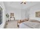 Large bedroom with natural light, neutral tones, and a cozy sitting area at 10471 Winghaven Dr, Noblesville, IN 46060
