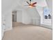 Upstairs Bonus Room with neutral walls and carpet featuring built in shelving at 10471 Winghaven Dr, Noblesville, IN 46060