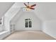 Bright and airy bonus room with vaulted ceiling, and large windows at 10471 Winghaven Dr, Noblesville, IN 46060