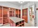 Large walk-in closet featuring custom built-in shelving and storage solutions at 10471 Winghaven Dr, Noblesville, IN 46060