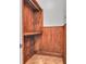 A walk-in closet with a tile floor, wooden trim and built-in wooden shelves at 10471 Winghaven Dr, Noblesville, IN 46060