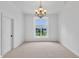 Formal dining room with a view of the yard through a large window at 10471 Winghaven Dr, Noblesville, IN 46060