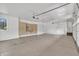 Large garage with bright white walls and cabinet storage at 10471 Winghaven Dr, Noblesville, IN 46060