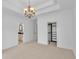 Spacious main bedroom with chandelier, neutral walls, and carpeted floors at 10471 Winghaven Dr, Noblesville, IN 46060