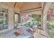 Cozy outdoor patio overlooking lush backyard with beautiful water view at 10471 Winghaven Dr, Noblesville, IN 46060