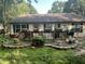 Backyard deck with well-maintained flowers and plenty of space for outdoor entertainment at 108 Meadowview Dr, Mooresville, IN 46158