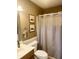 Cozy bathroom featuring a shower with a curtain, with artwork and a neutral color scheme at 108 Meadowview Dr, Mooresville, IN 46158